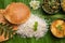 South IndianÂ style lunch or dinner meal or food served with a selection of recipes over banana leaf